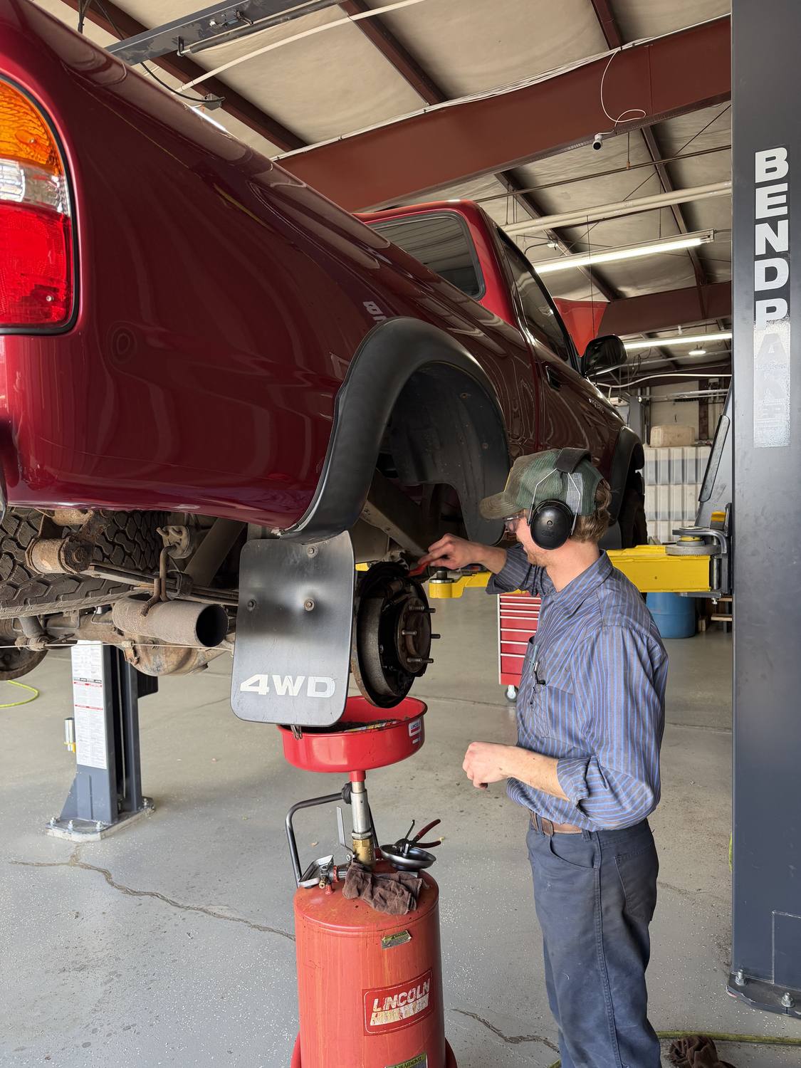 A Master Technician technician performing brake service on a Toyota